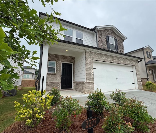 2277 Whitworth St, Lawrenceville, GA 30044 - view of front facade featuring brick siding, concrete driveway, and a garage