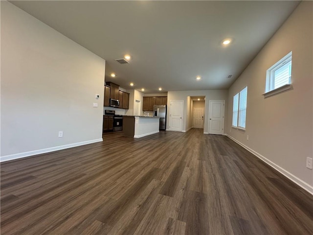 2277 Whitworth St, Lawrenceville, GA 30044 - unfurnished living room featuring dark wood-style flooring, baseboards, and recessed lighting