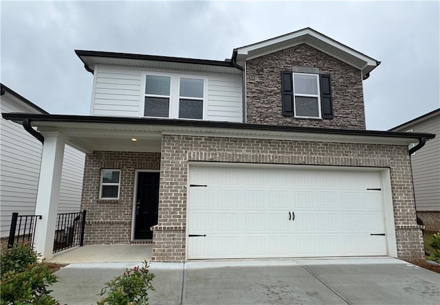 2277 Whitworth St, Lawrenceville, GA 30044 - traditional home with brick siding, concrete driveway, and a garage