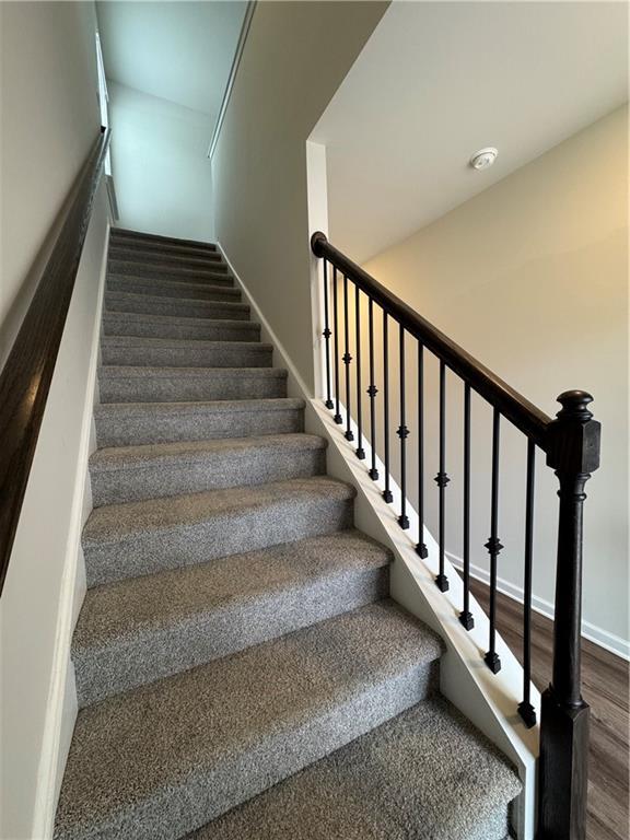 2277 Whitworth St, Lawrenceville, GA 30044 - stairs with wood finished floors and baseboards