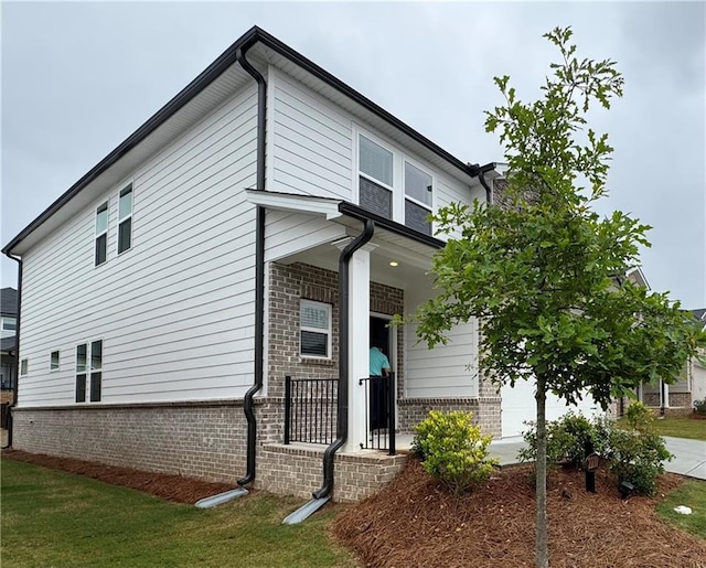 2277 Whitworth St, Lawrenceville, GA 30044 - view of front of house featuring brick siding, covered porch, and a front lawn