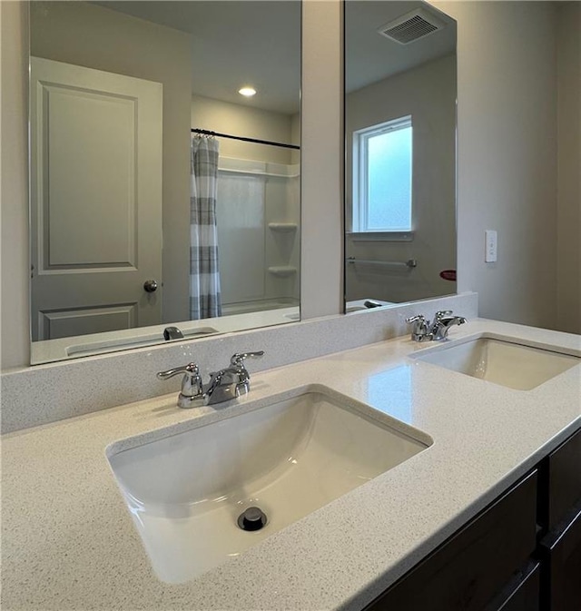 2277 Whitworth St, Lawrenceville, GA 30044 - bathroom featuring double vanity, a shower with shower curtain, and recessed lighting