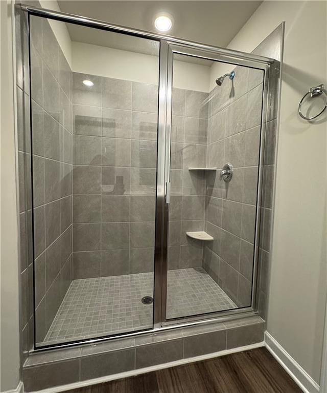 2277 Whitworth St, Lawrenceville, GA 30044 - full bath with wood finished floors, a shower stall, and baseboards