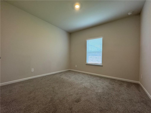 2277 Whitworth St, Lawrenceville, GA 30044 - carpeted empty room featuring baseboards, a smoke detector, and lofted ceiling