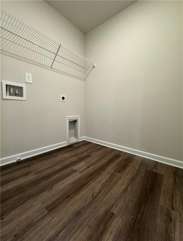 2277 Whitworth St, Lawrenceville, GA 30044 - laundry area featuring electric dryer hookup, hookup for a washing machine, dark wood-style flooring, and baseboards