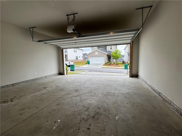 2277 Whitworth St, Lawrenceville, GA 30044 - garage featuring a garage door opener and baseboards