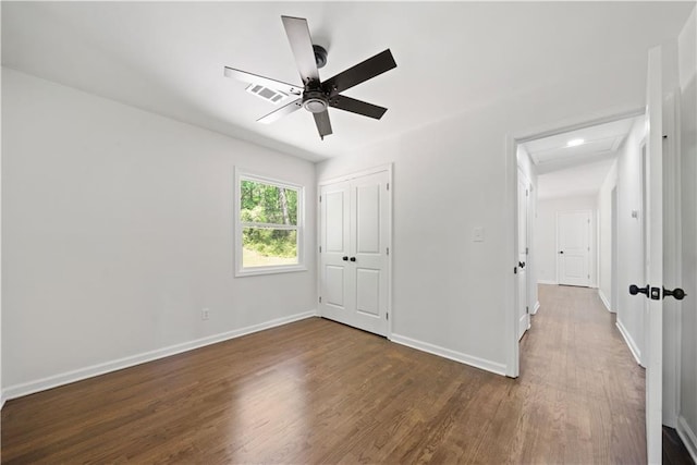 2340 Cresta Dr, Decatur, GA 30032 - unfurnished bedroom featuring wood finished floors, baseboards, a closet, and attic access