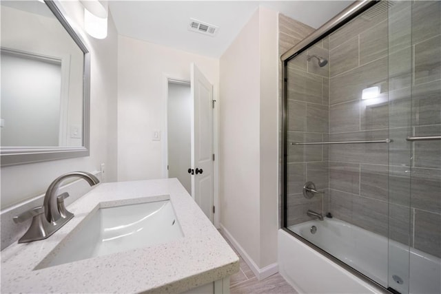 2340 Cresta Dr, Decatur, GA 30032 - bathroom featuring bath / shower combo with glass door, vanity, and baseboards