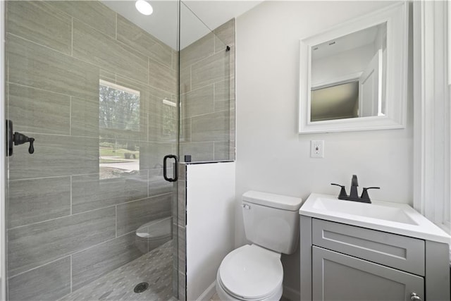 2340 Cresta Dr, Decatur, GA 30032 - bathroom featuring a stall shower, toilet, and vanity