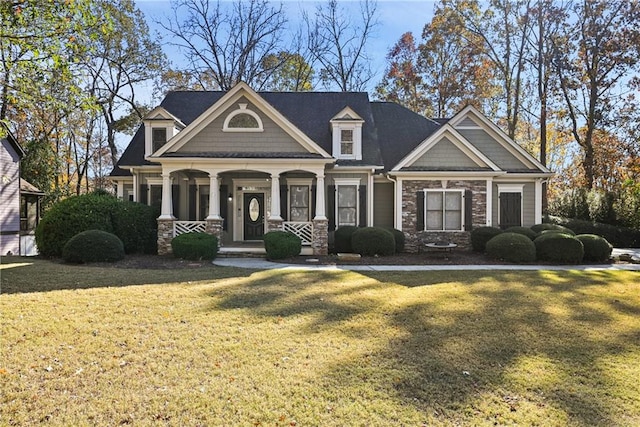 craftsman-style house with a front yard and a porch