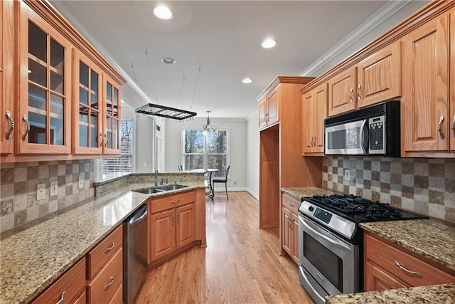403 Pebblebrooke Ln, Canton, GA 30115 - kitchen featuring stainless steel appliances, a sink, recessed lighting, ornamental molding, and glass insert cabinets