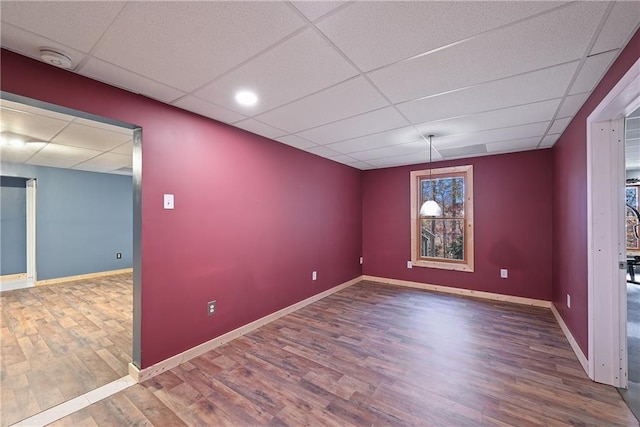 403 Pebblebrooke Ln, Canton, GA 30115 - unfurnished room with a paneled ceiling, wood finished floors, baseboards, and a smoke detector