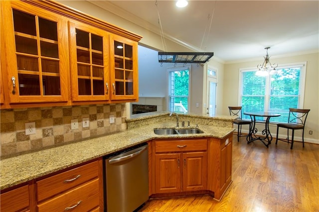 403 Pebblebrooke Ln, Canton, GA 30115 - kitchen with dishwasher, a sink, crown molding, brown cabinetry, and a peninsula
