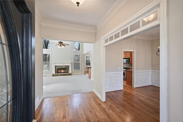 403 Pebblebrooke Ln, Canton, GA 30115 - hall with crown molding, wood finished floors, wainscoting, and a decorative wall