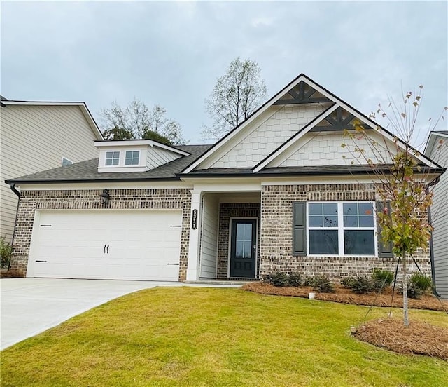 view of front of house with a garage and a front lawn