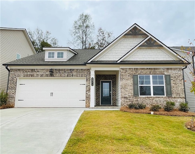 view of front facade featuring a garage and a front lawn