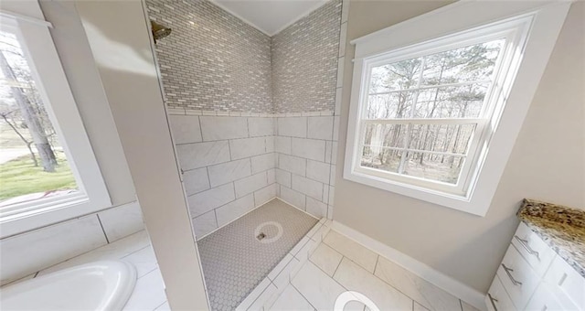 bathroom with tile patterned flooring and separate shower and tub