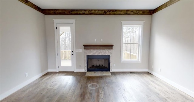 unfurnished living room featuring hardwood / wood-style flooring