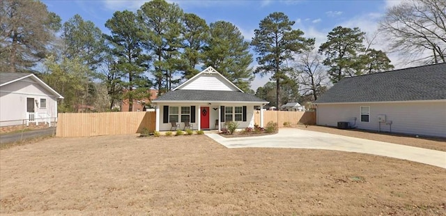 view of front facade with cooling unit and covered porch