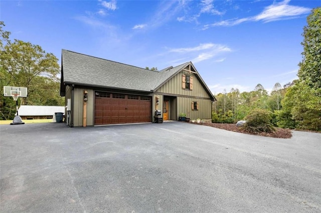 view of side of property with a garage