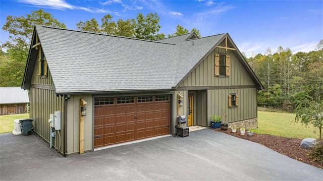 modern farmhouse with a front lawn and a garage