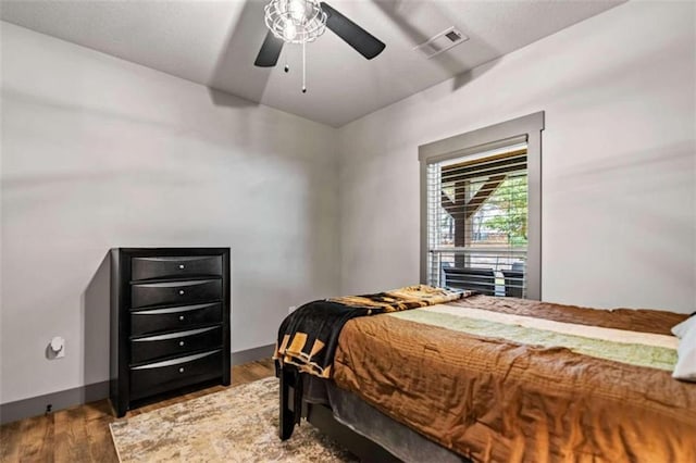 bedroom with hardwood / wood-style flooring and ceiling fan