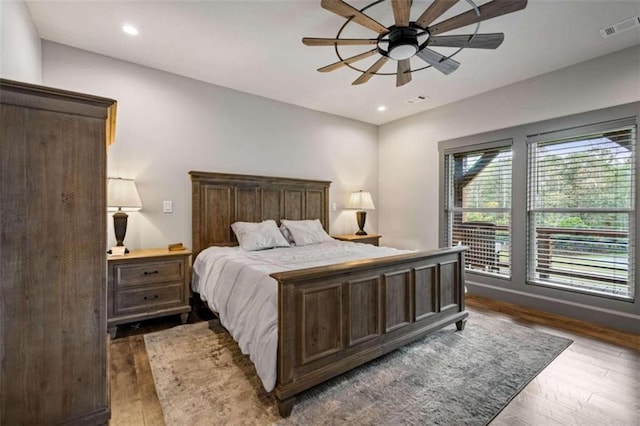 bedroom featuring dark hardwood / wood-style floors and ceiling fan