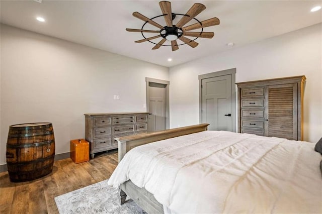 bedroom featuring ceiling fan and light hardwood / wood-style flooring