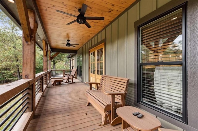 wooden deck featuring ceiling fan