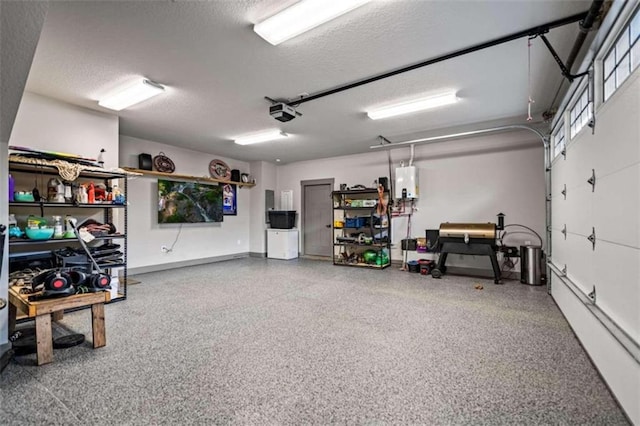 garage with a garage door opener and water heater