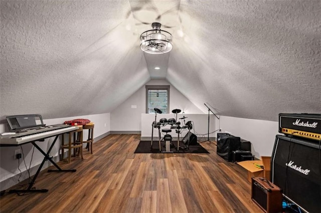 office space featuring lofted ceiling, a textured ceiling, and wood-type flooring