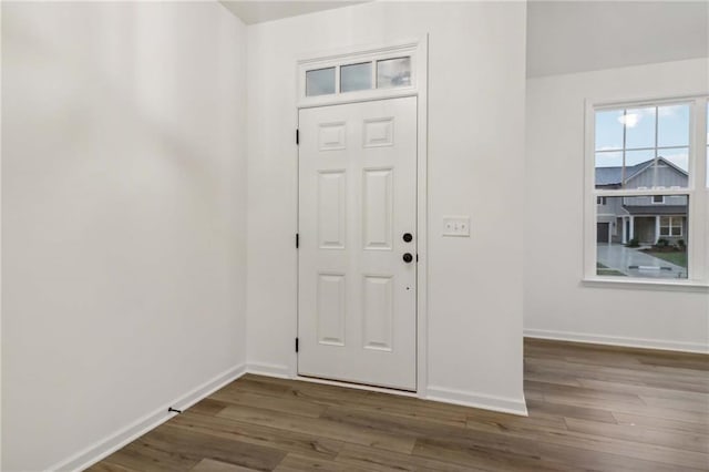 entrance foyer with wood finished floors and baseboards