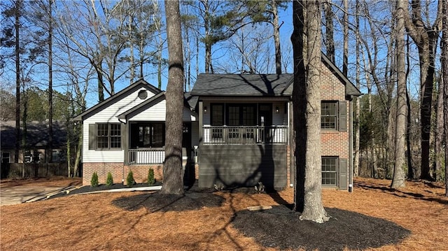 view of front of property with brick siding and covered porch