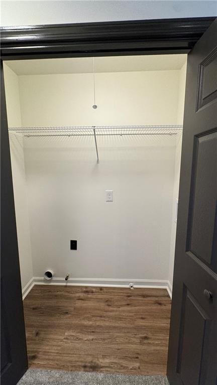 washroom featuring dark wood-type flooring and baseboards