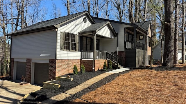 view of front facade featuring a garage, brick siding, and driveway