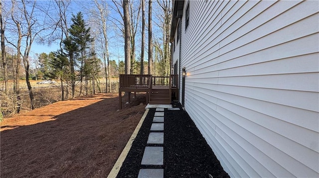 view of home's exterior with a wooden deck