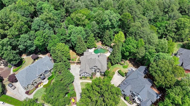 7920 Tintern Trce, Duluth, GA 30097 - view of property location featuring a forest and a pool area