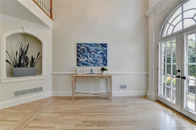 7920 Tintern Trce, Duluth, GA 30097 - foyer entrance with a high ceiling, wood finished floors, french doors, and baseboards