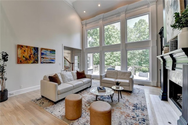 7920 Tintern Trce, Duluth, GA 30097 - living room featuring high vaulted ceiling, light wood-style flooring, healthy amount of natural light, baseboards, and recessed lighting