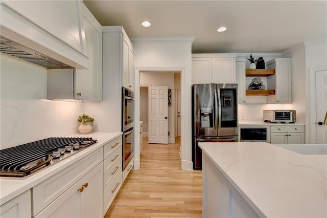 7920 Tintern Trce, Duluth, GA 30097 - kitchen featuring appliances with stainless steel finishes, custom range hood, light wood-style flooring, open shelves, and recessed lighting