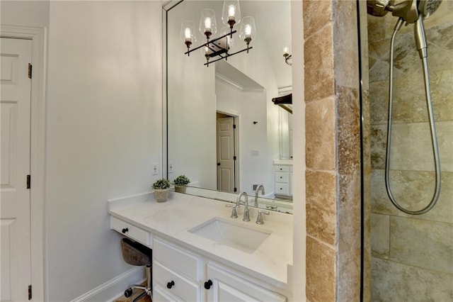 7920 Tintern Trce, Duluth, GA 30097 - full bath featuring a tile shower, vanity, a chandelier, and baseboards