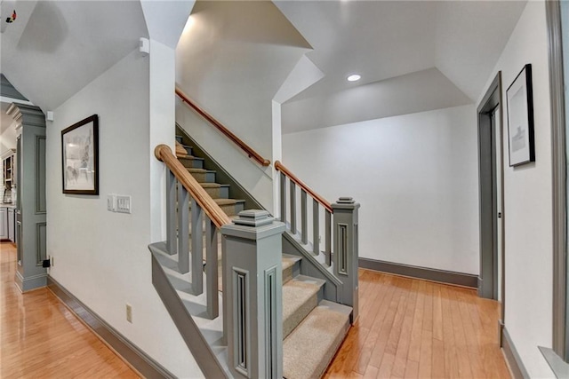 7920 Tintern Trce, Duluth, GA 30097 - stairs with wood finished floors, lofted ceiling, baseboards, and recessed lighting