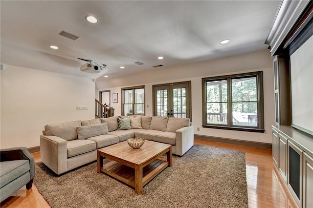 7920 Tintern Trce, Duluth, GA 30097 - living area featuring light wood-style floors, recessed lighting, stairs, french doors, and baseboards