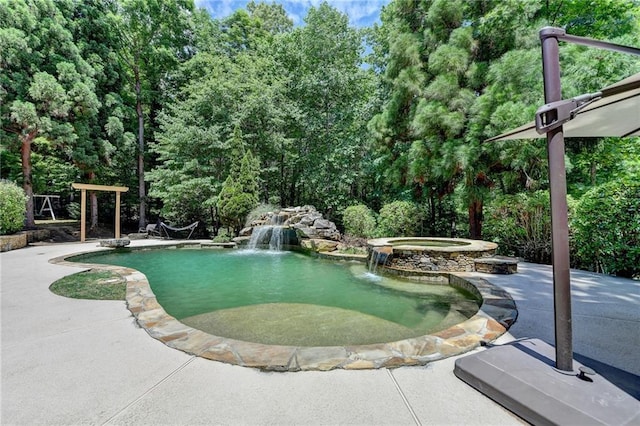 7920 Tintern Trce, Duluth, GA 30097 - view of swimming pool with a patio area and a pool with connected hot tub