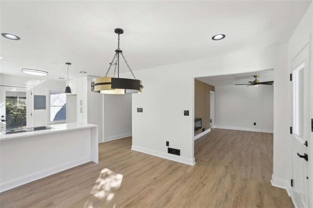 interior space with recessed lighting, baseboards, and wood finished floors