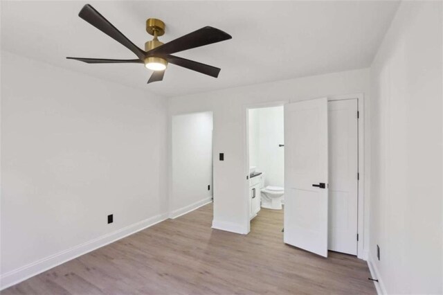 unfurnished bedroom with baseboards, connected bathroom, a ceiling fan, and light wood-style floors