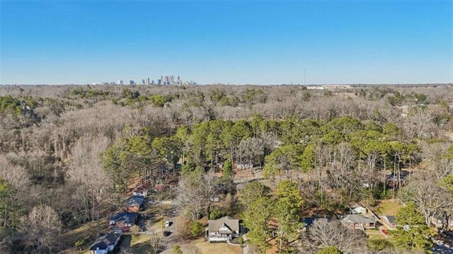 birds eye view of property with a wooded view