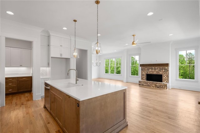326 Reese Way, Ball Ground, GA 30107 - kitchen featuring a sink, a ceiling fan, crown molding, light wood-style flooring, and recessed lighting