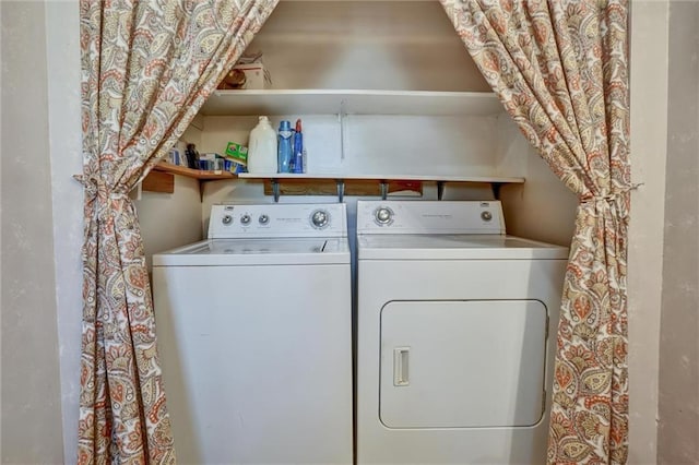 clothes washing area with washer and dryer