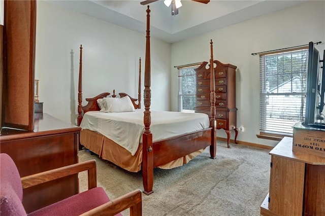 bedroom featuring light colored carpet and ceiling fan